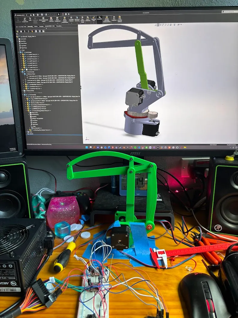 The assembled 2-DOF arm in front of the 3-DOF addon modelled in SolidWorks