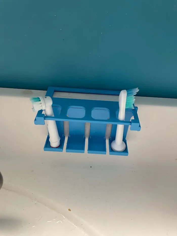 Blue 3D-printed toothbrush head holder and drying rack