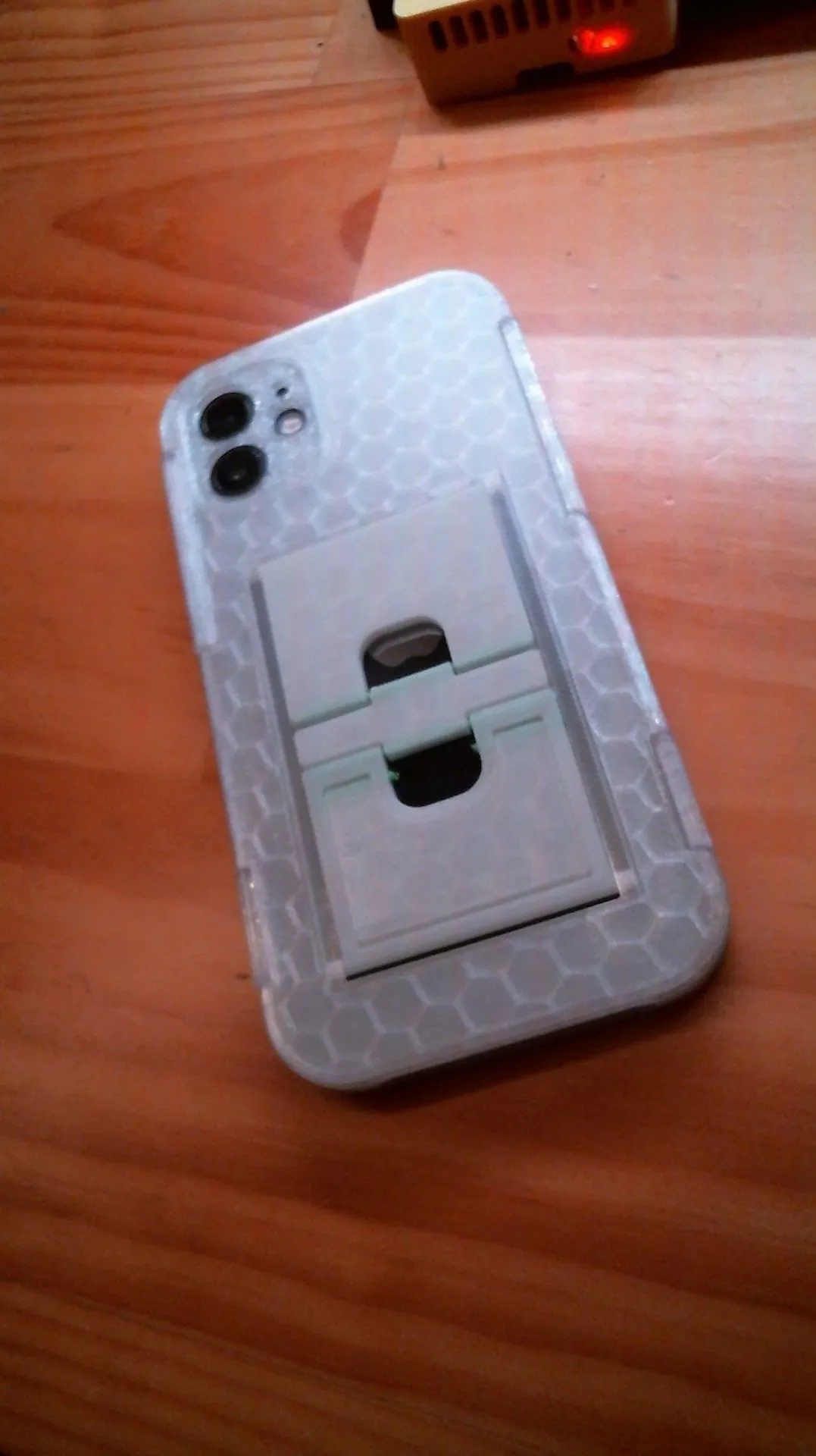 Folding phone kickstand case lying flat, kickstand folded away